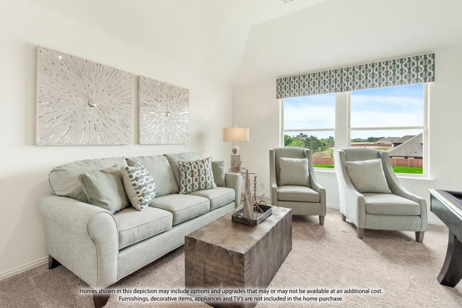 Living room with light gray sofa, two accent chairs, wood coffee table, and large window with outdoor view