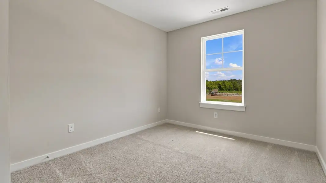 Secondary bedroom with window and versatile living options