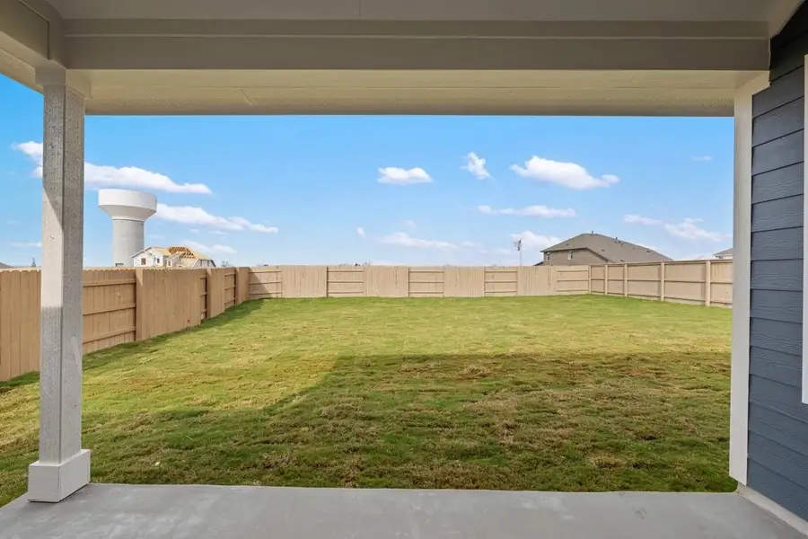 Exterior details and patio area of a home in The Colony 50s, Bastrop (Image 4).