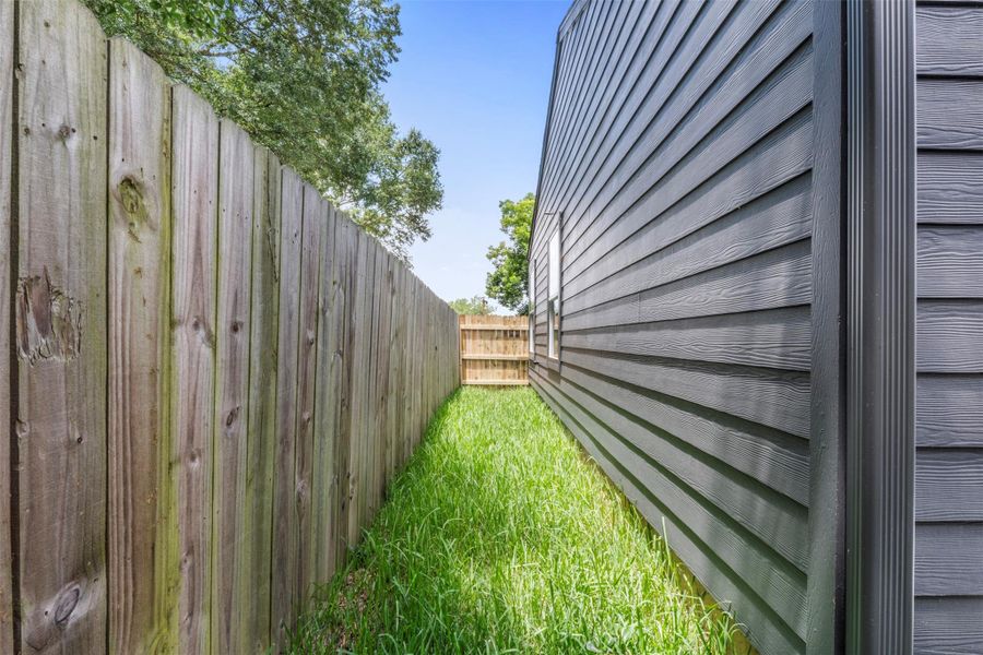 Exterior details and patio area of a home in , Houston (Image 26). Exterior details and patio area of a home in , Houston (Image 26).