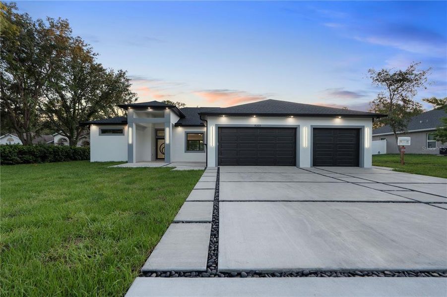 Front exterior of a new home in , Weeki Wachee, FL, highlighting curb appeal (Image 34).