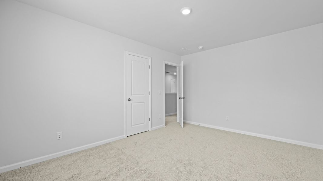 Spacious, unfurnished interior of a new home in Pine Hills Townhomes at Cane Bay, Summerville (Image 25).