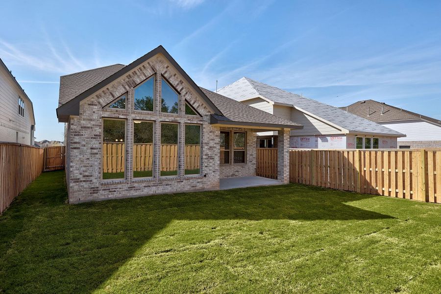 Exterior details and patio area of a home in Parmer Ranch, Georgetown (Image 22).