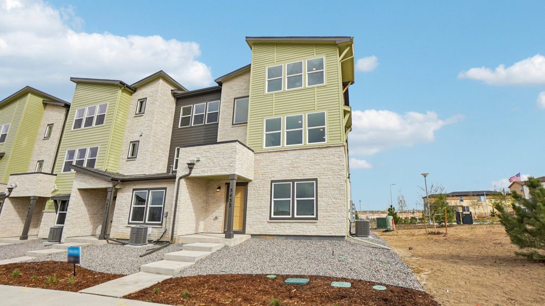 Front exterior of a new home in Windler Townhomes, Aurora, CO, highlighting curb appeal (Image 1). Front exterior of a new home in Windler Townhomes, Aurora, CO, highlighting curb appeal (Image 1).