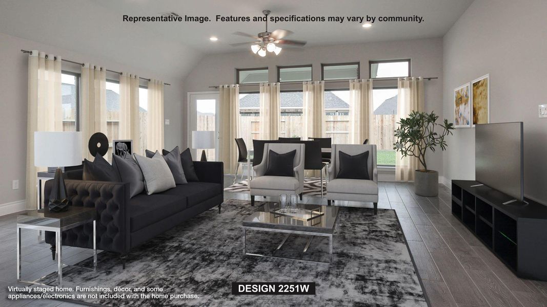 Living room with wood finished floors, recessed lighting, ceiling fan, and vaulted ceiling Living room with wood finished floors, recessed lighting, ceiling fan, and vaulted ceiling