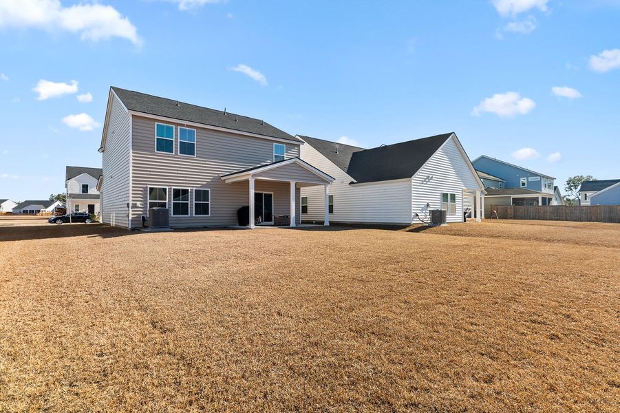 Exterior details and patio area of a home in Heron's Walk at Summers Corner, Summerville (Image 25).