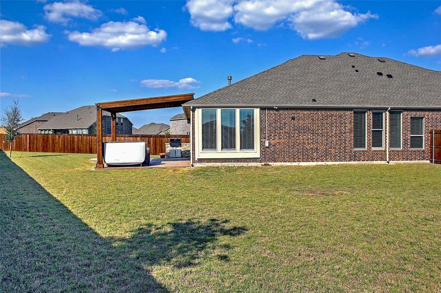 Exterior details and patio area of a home in Preserve at Honey Creek: Brookstone Collection, McKinney (Image 18).