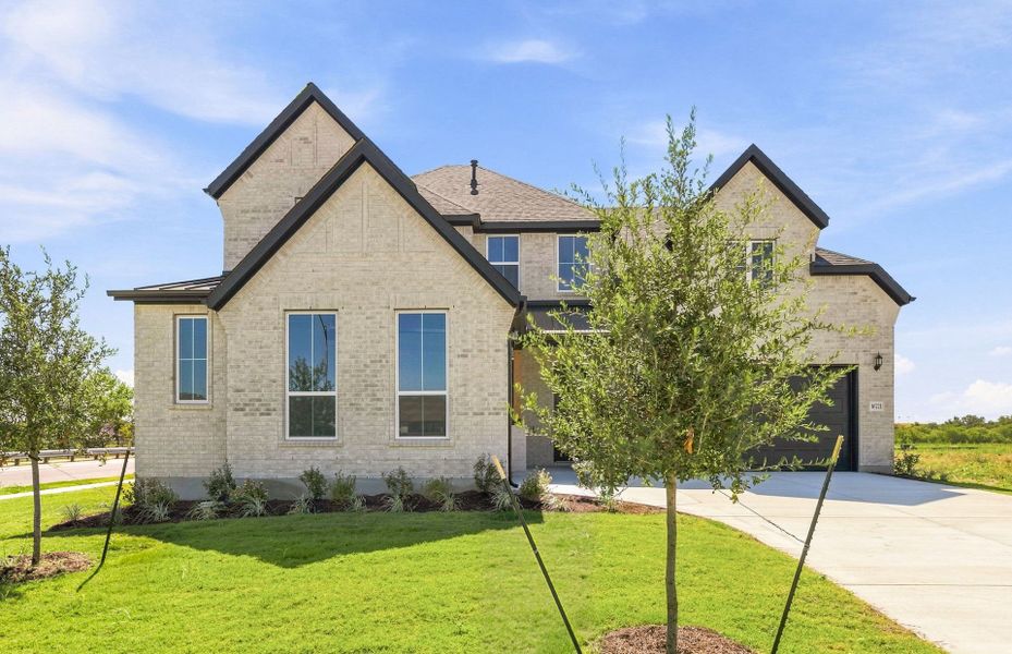 Front exterior of a new home in Kuempel Estates, Pflugerville, TX, highlighting curb appeal (Image 23).