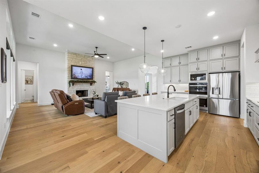 This kitchen is a showstopper with so much cabinet space & quartz counters.
