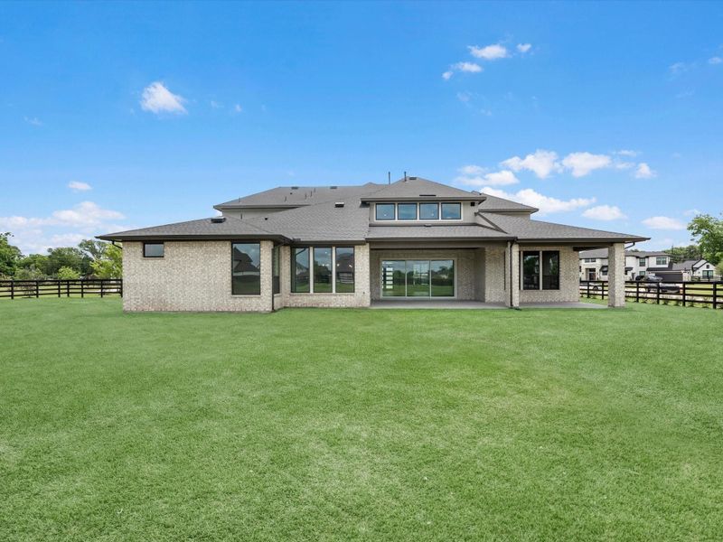 Exterior details and patio area of a home in The Estates at James Lane, Fulshear (Image 21).