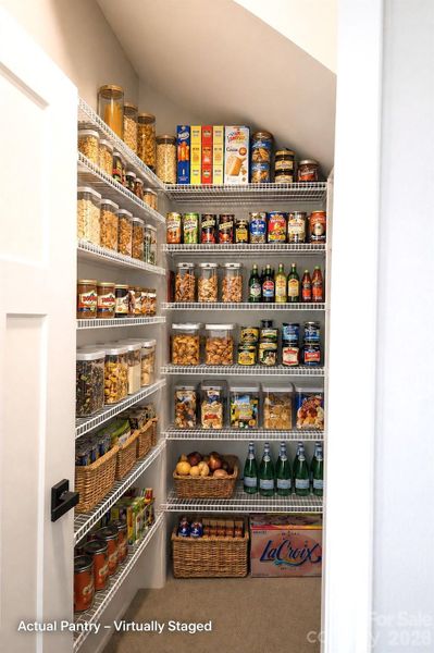 Pantry is virtually staged.