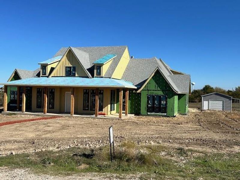 View of front of property with an outdoor structure