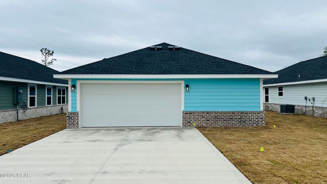 Front exterior of a new home in East Bay, Panama City, FL, highlighting curb appeal (Image 2). Front exterior of a new home in East Bay, Panama City, FL, highlighting curb appeal (Image 2).