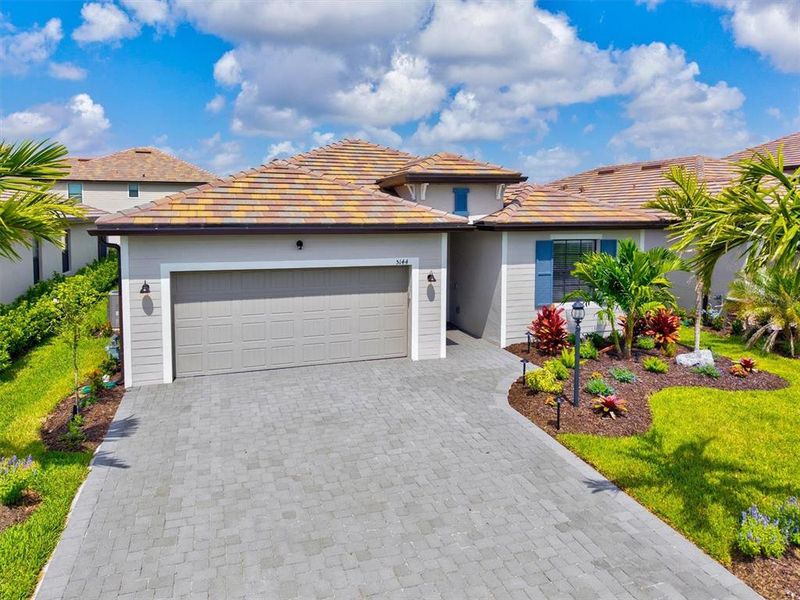 Front exterior of a new home in , Bradenton, FL, highlighting curb appeal (Image 23).