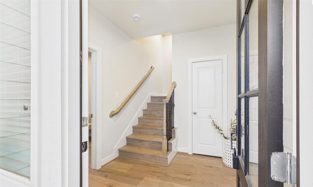 Enter into the home with an inviting foyer with a coat closet.