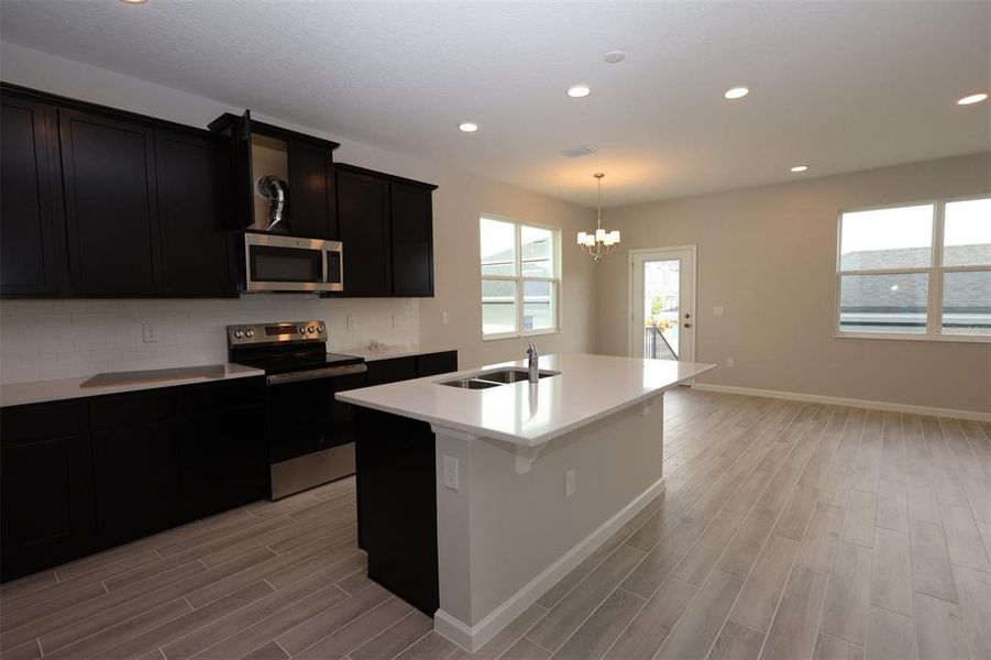 Furnished interior view inside a new home in Tribute at Ovation, Winter Garden (Image 7).