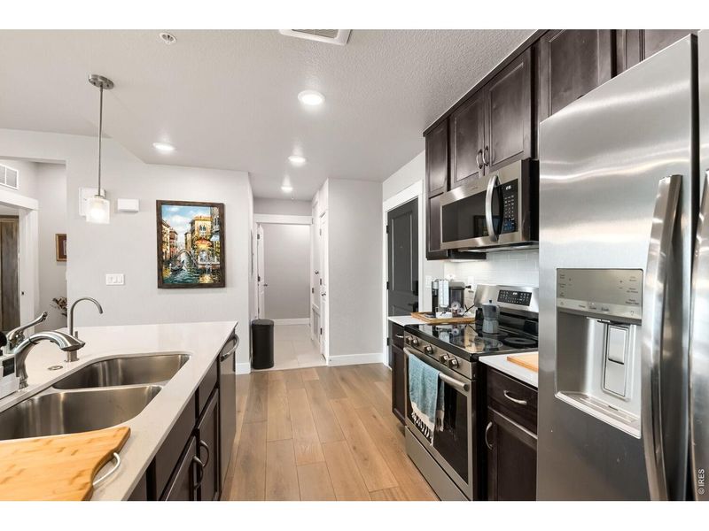 Furnished interior view inside a new home in Highlands at Fox Hill - The Flats, Longmont (Image 14).
