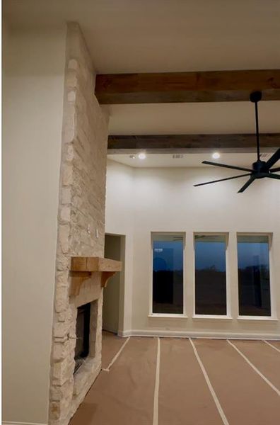 You will love the wood floors, stone on the fireplace and strong beams.