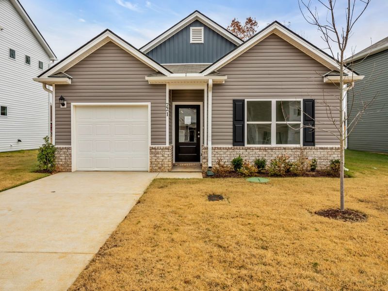 Front exterior of a new home in Cantigny Park, Clarksville, TN, highlighting curb appeal (Image 1).