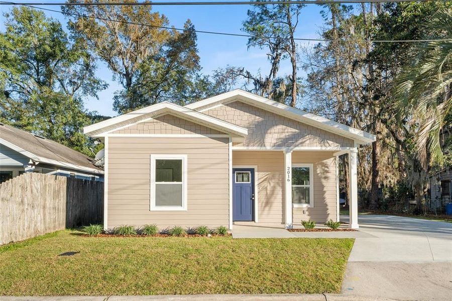 Front exterior of a new home in , Gainesville, FL, highlighting curb appeal (Image 17).