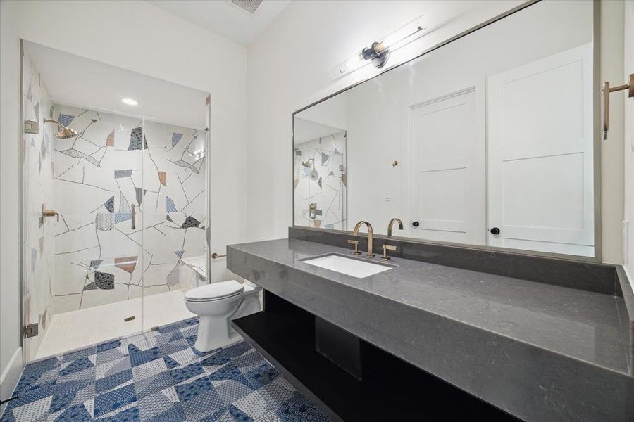 Each bathroom in this home features its own custom color tile, creating a unique and stunning visual experience. From vibrant blues to serene earth tones, the carefully selected tiles add a personalized touch to each space. The custom designs not only enhance the aesthetic appeal but also reflect a distinct character, making every bathroom a one-of-a-kind retreat.