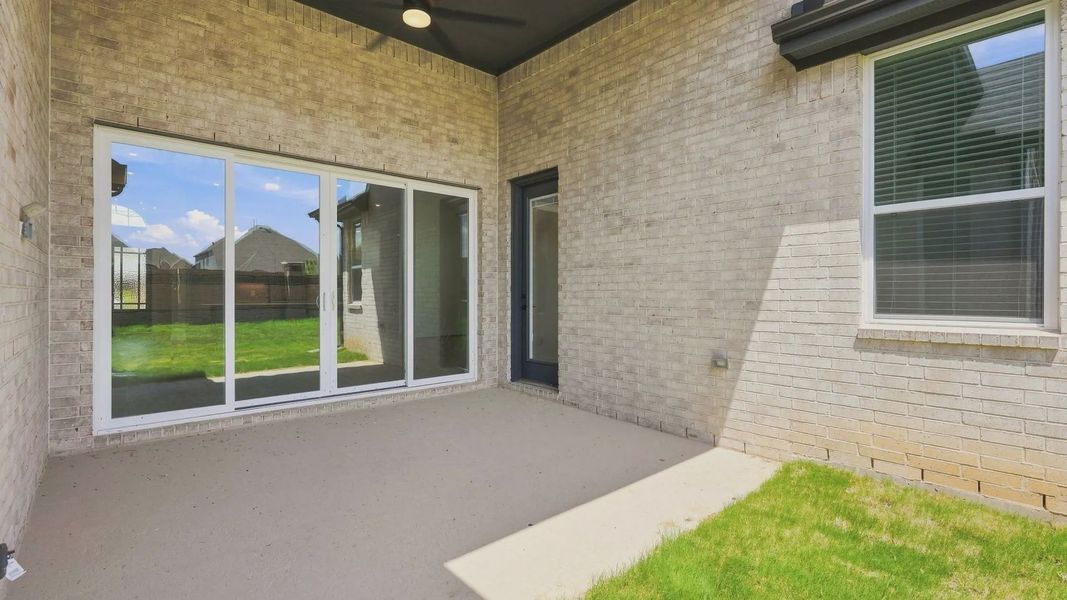 Exterior details and patio area of a home in Elyson 50's, Katy (Image 4).