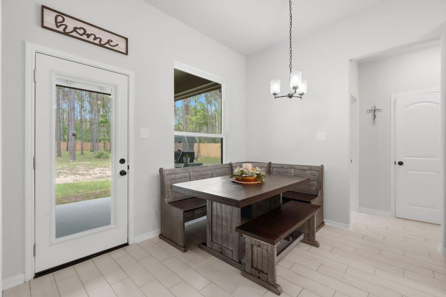 Cozy breakfast area with natural light and easy access to the covered patio.