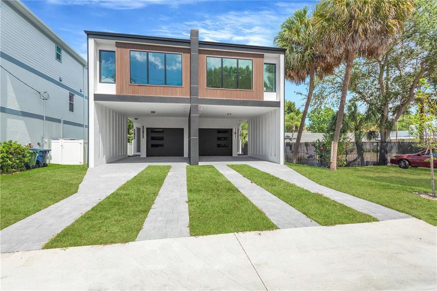 Front exterior of a new home in , Tampa, FL, highlighting curb appeal (Image 19). Front exterior of a new home in , Tampa, FL, highlighting curb appeal (Image 19).