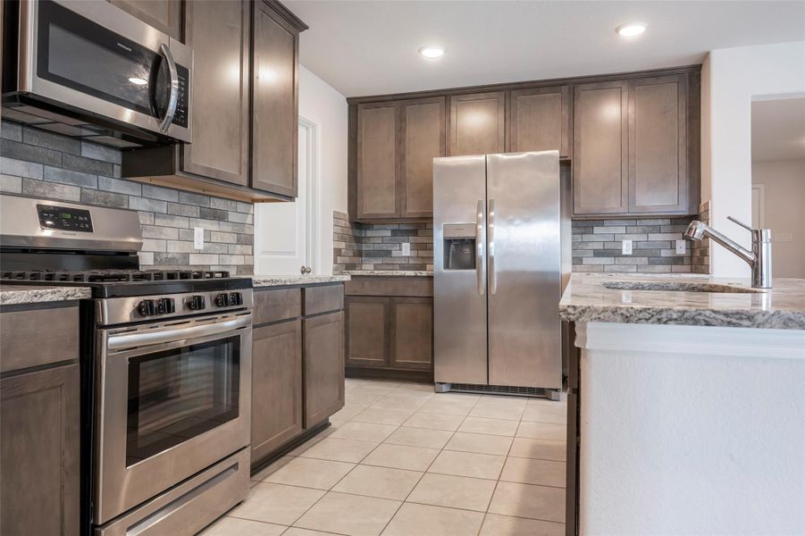 Furnished interior view inside a new home in Sunterra, Katy (Image 10).