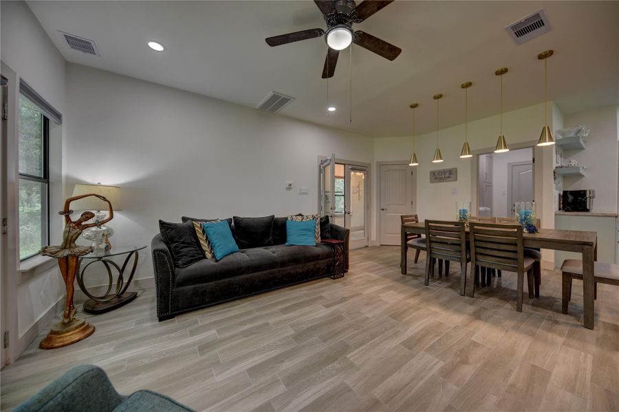 Welcoming Living Area, off the Dining Area, perfect for Family Gatherings. All Window Treatments are Remote Controlled, Except for areas were there are curtains. 1st Floor Welcoming Living Area, off the Dining Area, perfect for Family Gatherings. All Window Treatments are Remote Controlled, Except for areas were there are curtains. 1st Floor