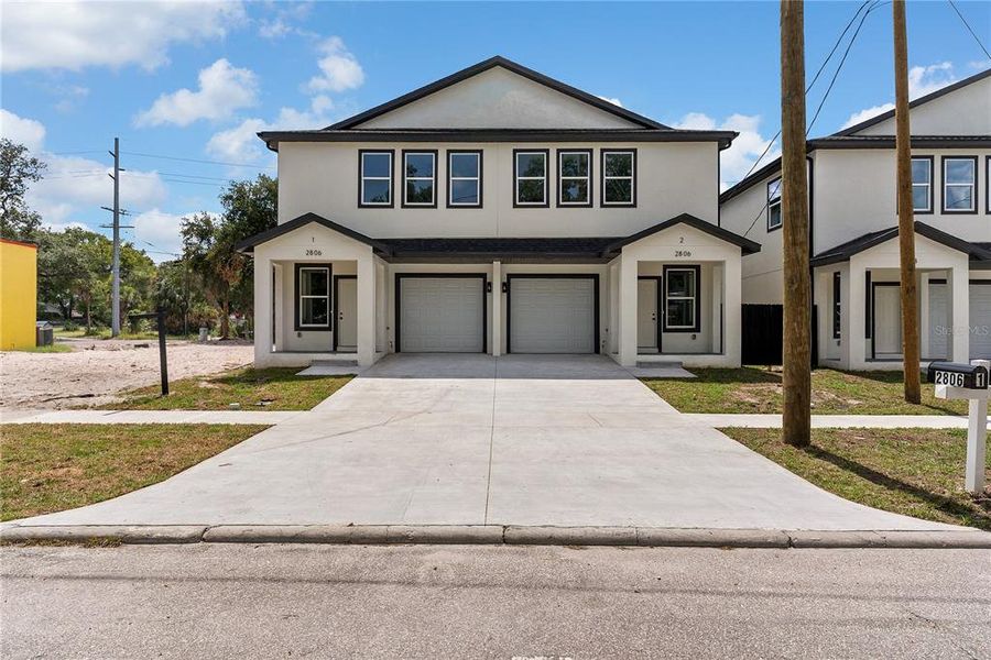Front exterior of a new home in , Tampa, FL, highlighting curb appeal (Image 20).