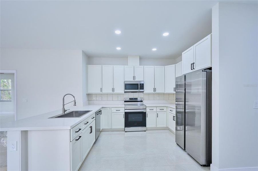 Furnished interior view inside a new home in , Indian Lake Estates (Image 8).