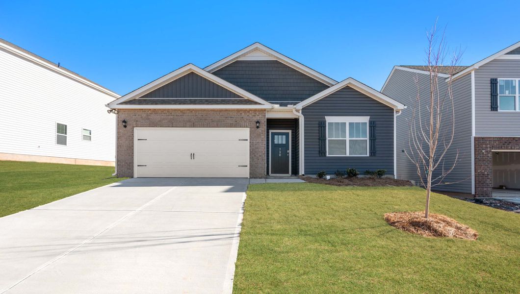 Front exterior of a new home in Sage Grove, Lyman, SC, highlighting curb appeal (Image 1).