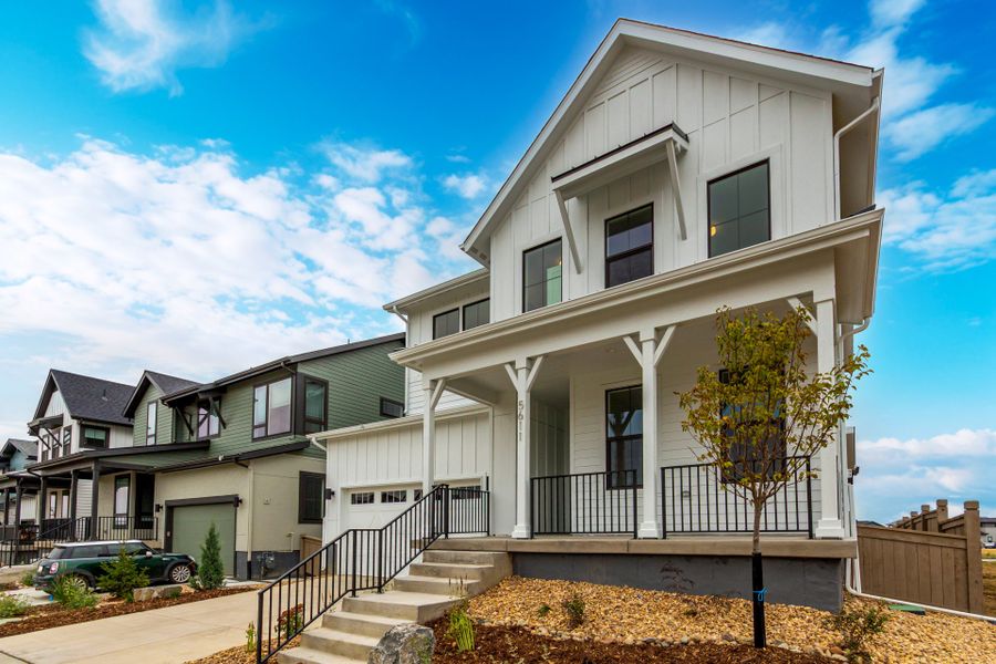 Front exterior of a new home in West Grange, Longmont, CO, highlighting curb appeal (Image 26).