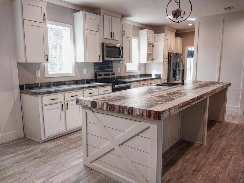 Furnished interior view inside a new home in , Frostproof (Image 5). Furnished interior view inside a new home in , Frostproof (Image 5).