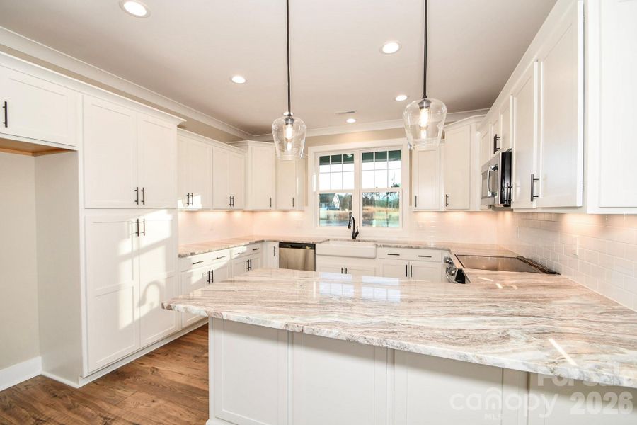 Furnished interior view inside a new home in , Wingate (Image 6).