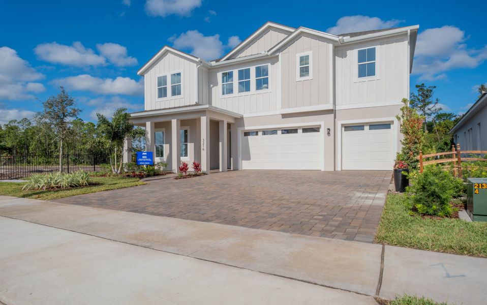 Representative exterior photo of a completed home built from the Ibis by Jones Homes USA in Legends Preserve, Daytona Beach, FL (Image 22).
