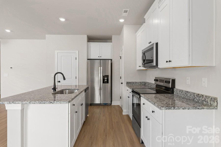 Furnished interior view inside a new home in Stagecoach Station, Gastonia (Image 6).