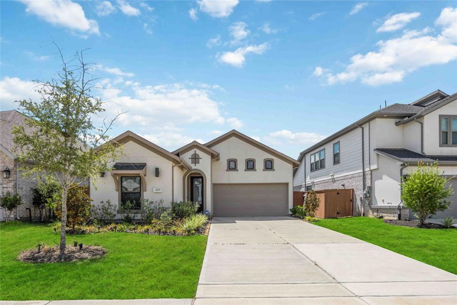 Front exterior of a new home in Elyson 45' & 70', Katy, TX, highlighting curb appeal (Image 21).