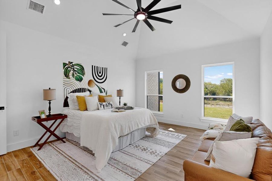 Bedroom with recessed lighting, light wood finished floors, high vaulted ceiling, and a ceiling fan