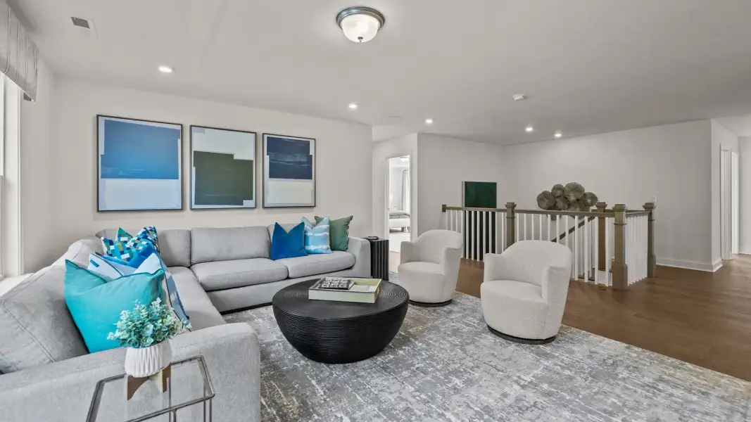 Ample loft with premium flooring, elevated ceiling, and open rail, in the Townsend Design by DRB Homes in York, SC Ample loft with premium flooring, elevated ceiling, and open rail, in the Townsend Design by DRB Homes in York, SC