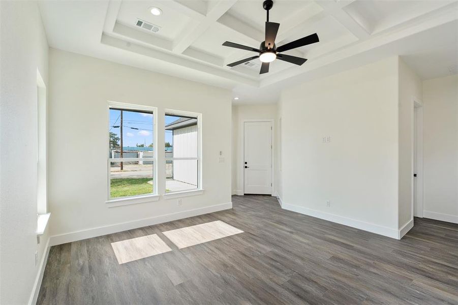 Spare room featuring coffered ceiling, recessed lighting, wood finished floors, beam ceiling, and a ceiling fan Spare room featuring coffered ceiling, recessed lighting, wood finished floors, beam ceiling, and a ceiling fan