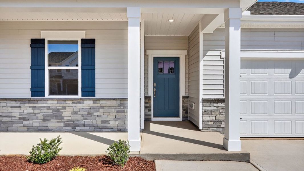 Exterior details and patio area of a home in Tyler - Home on the Lake, New Bern (Image 3).