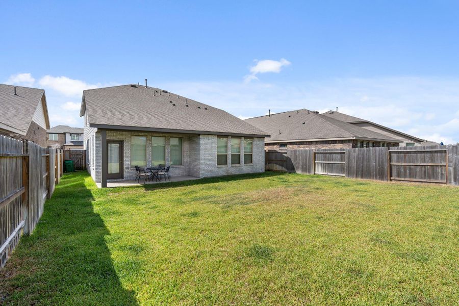 Exterior details and patio area of a home in Sunterra, Katy (Image 28).