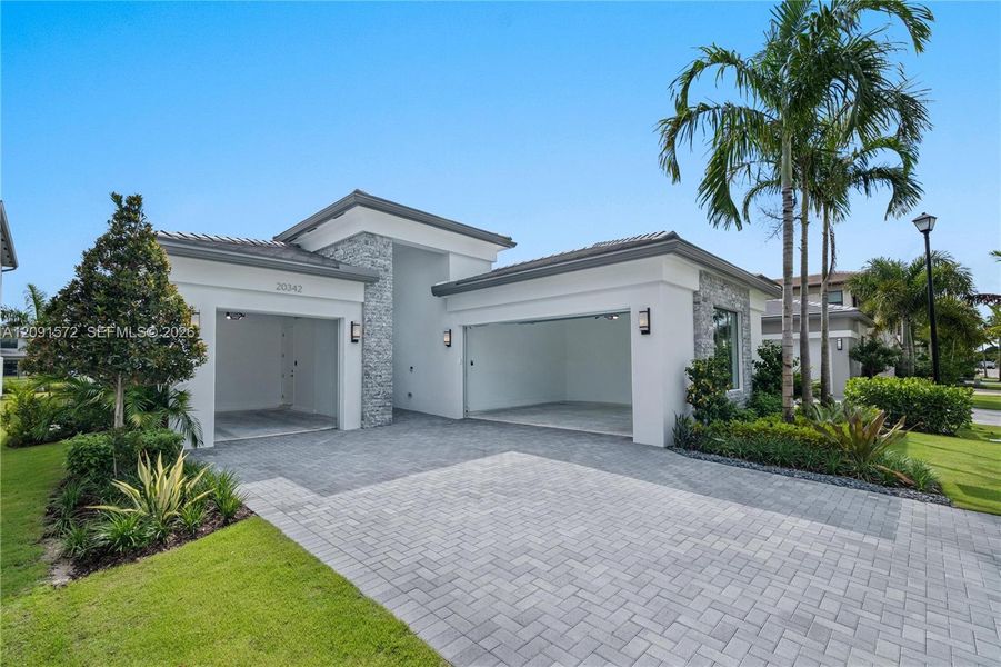 Front exterior of a new home in , Boca Raton, FL, highlighting curb appeal (Image 26). Front exterior of a new home in , Boca Raton, FL, highlighting curb appeal (Image 26).