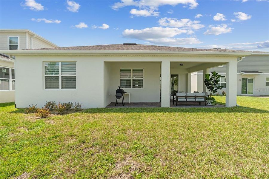 Front exterior of a new home in Savannah Palms, Orlando, FL, highlighting curb appeal (Image 19).