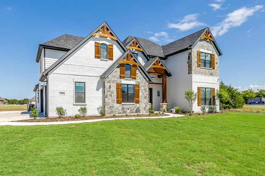 Representative exterior photo of a completed home built from the The Peyton by Elmwood Custom Homes in Matthews Farm, Venus, TX (Image 3). Representative exterior photo of a completed home built from the The Peyton by Elmwood Custom Homes in Matthews Farm, Venus, TX (Image 3).