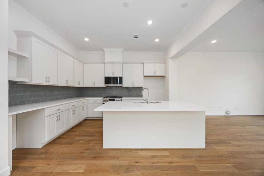 Zoom in on the beauty: crisp cabinetry, statement lighting, and luxurious quartz countertops—each detail curated to blend function and flair.