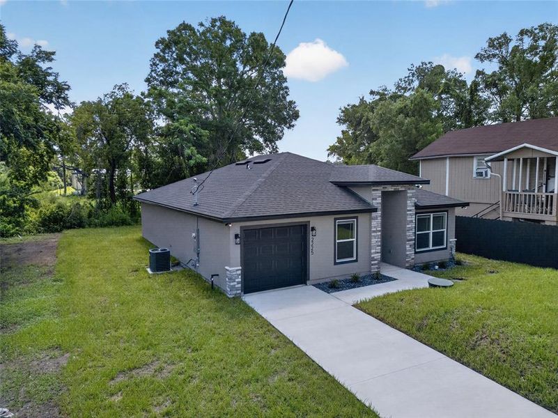 Front exterior of a new home in , Sanford, FL, highlighting curb appeal (Image 27). Front exterior of a new home in , Sanford, FL, highlighting curb appeal (Image 27).