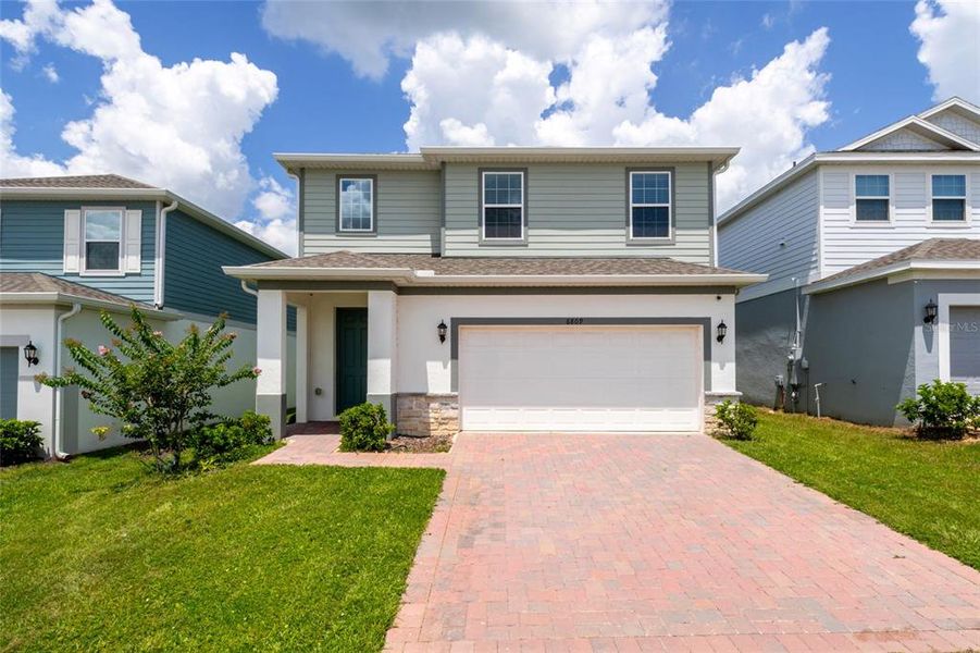 Front exterior of a new home in , Howey-in-the-Hills, FL, highlighting curb appeal (Image 27).